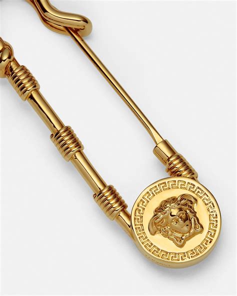 versace safety pin brooch.